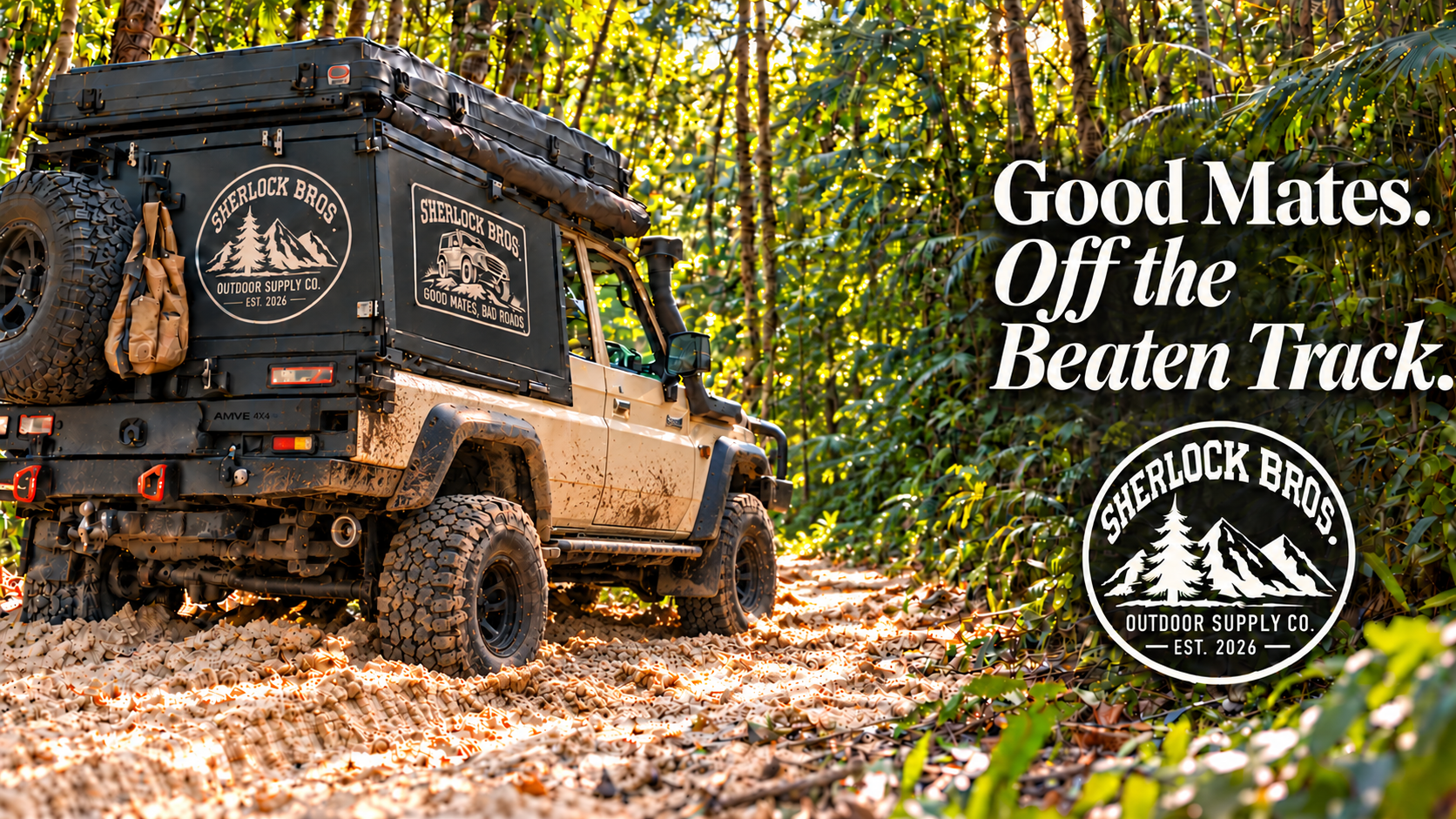 Sherlock Bros. branded expedition 4x4 on a sunlit sandy rainforest track. Good Mates. Off the Beaten Track.